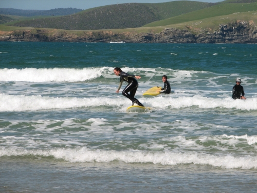 Surfing in Porpoise Bay